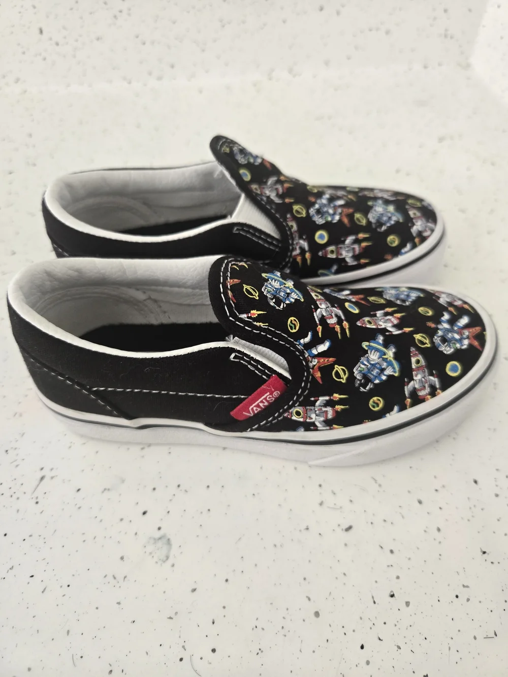 Vans Kids Slip-On Sneakers in Black with Multicolor Robot Print